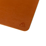 Load image into Gallery viewer, Brown leather desk mat with Ryskape logo
